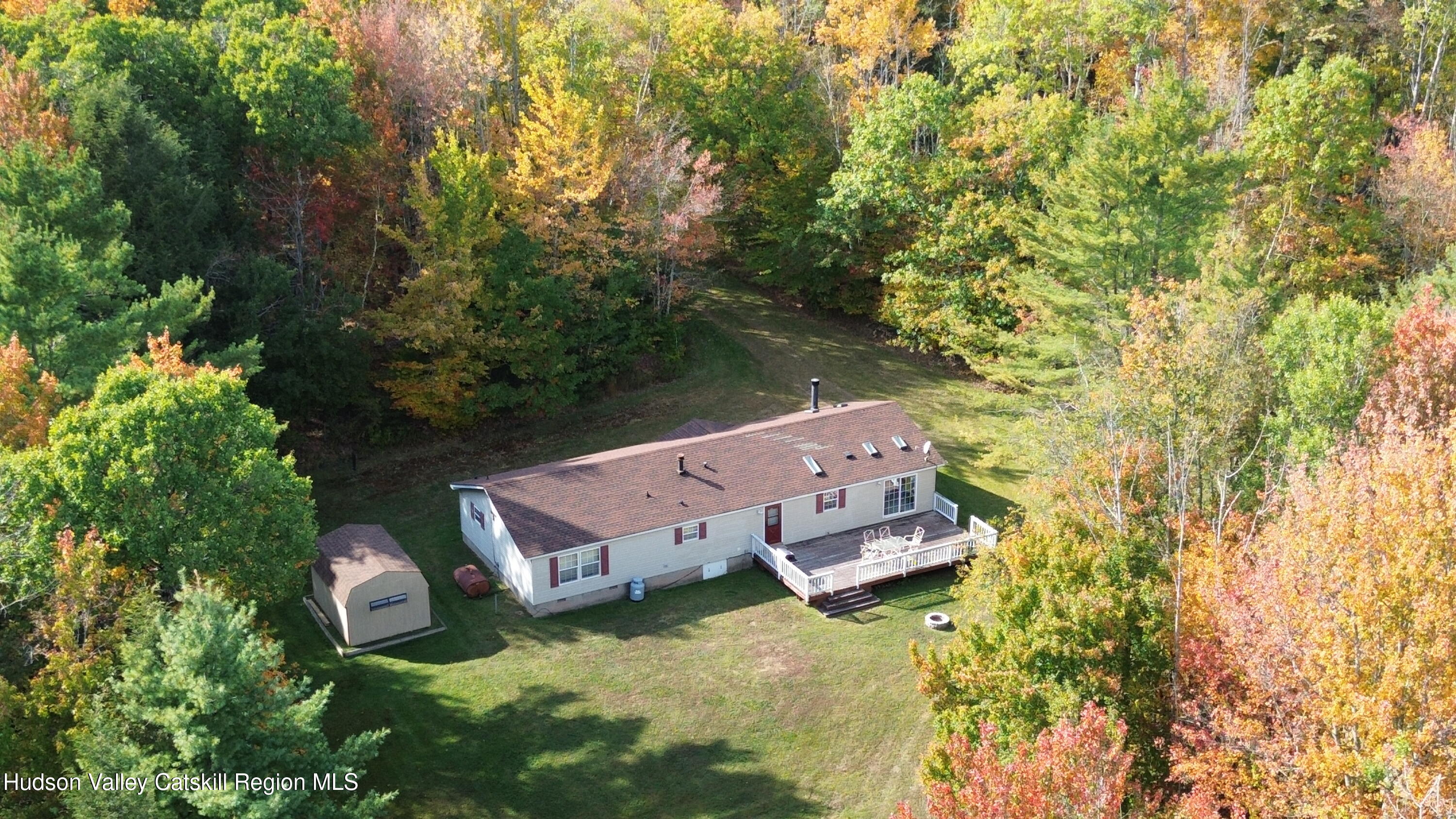 370 Begley Road Windham, NY 12496 - Photo 48 of 51 an aerial view of a house with swimming pool and wooden bench