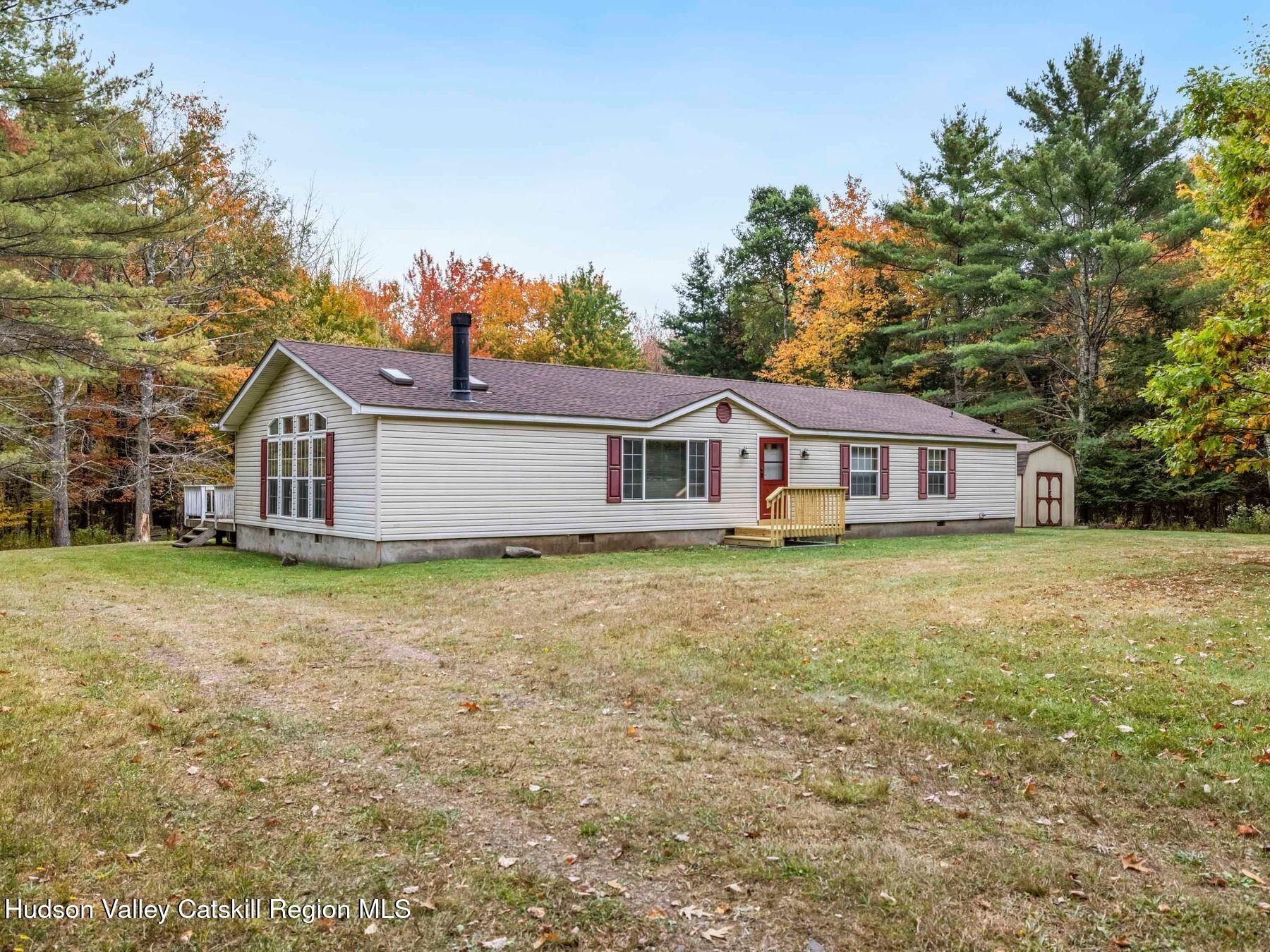 370 Begley Road Windham, NY 12496 - Photo 9 of 51 a front view of a house with garden