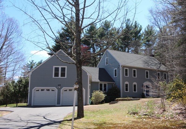 4 Lyn Path Hopkinton, MA 01748 - Photo 1 of 28 a front view of a house with a yard covered in snow