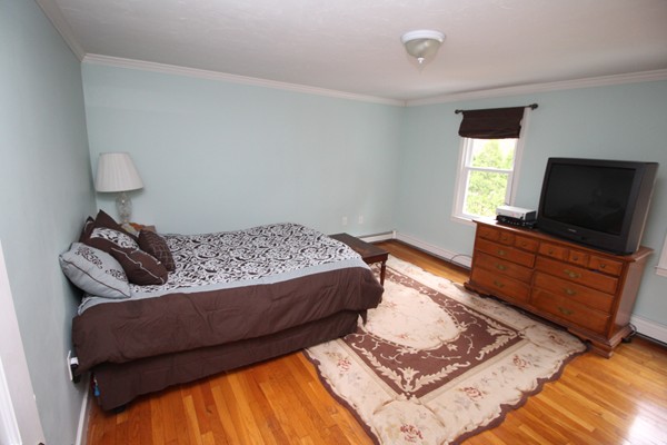 4 Lyn Path Hopkinton, MA 01748 - Photo 19 of 28 a living room with couches and flat screen tv