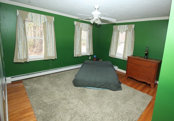 4 Lyn Path Hopkinton, MA 01748 - Photo 20 of 28 a living room with furniture and a chandelier