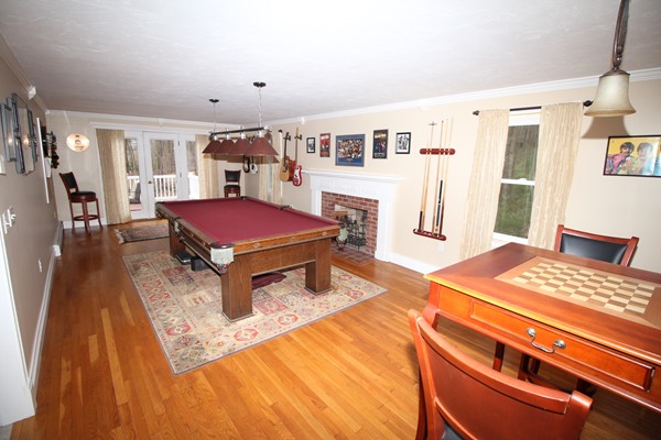 4 Lyn Path Hopkinton, MA 01748 - Photo 2 of 28 a living room with furniture a flat screen tv and a table