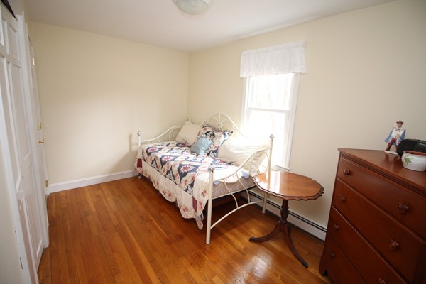 4 Lyn Path Hopkinton, MA 01748 - Photo 21 of 28 a bedroom with a bed and a window