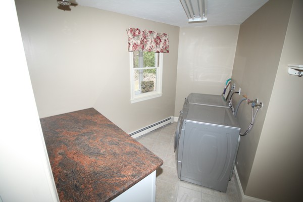 4 Lyn Path Hopkinton, MA 01748 - Photo 22 of 28 a bathroom with a granite countertop sink and a vanity