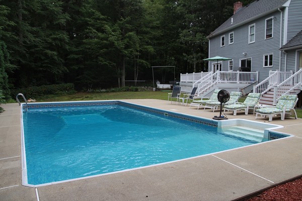 4 Lyn Path Hopkinton, MA 01748 - Photo 26 of 28 a view of a swimming pool with lounge chair