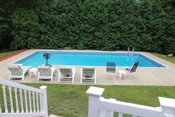 4 Lyn Path Hopkinton, MA 01748 - Photo 27 of 28 a view of a backyard with a small deck