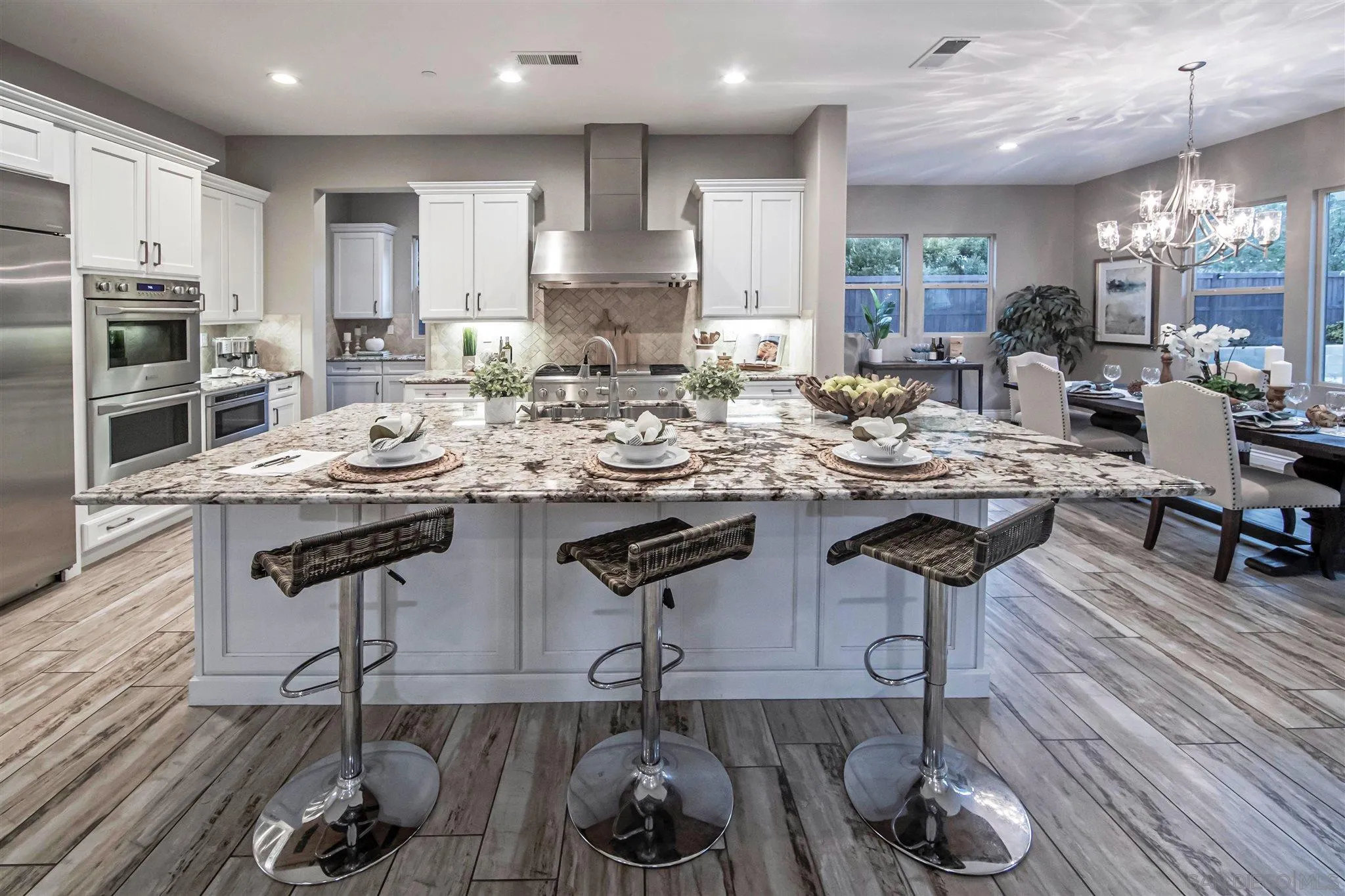 545 Ledge Street San Marcos, CA 92078 - Photo 12 of 55 a kitchen with stainless steel appliances granite countertop a sink counter space and cabinets
