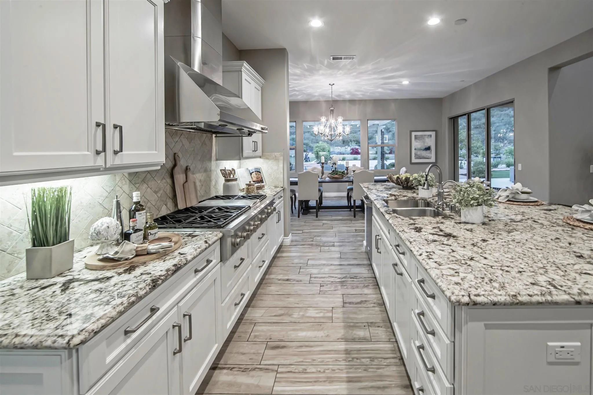 545 Ledge Street San Marcos, CA 92078 - Photo 15 of 55 a large kitchen with granite countertop lots of counter top space and stainless steel appliances