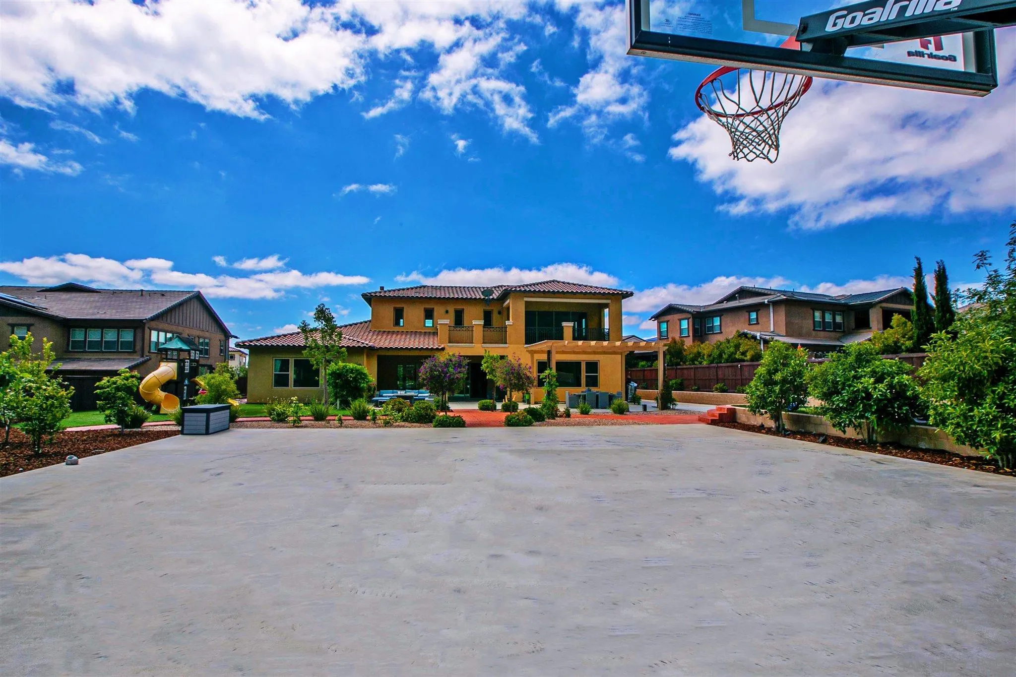 545 Ledge Street San Marcos, CA 92078 - Photo 2 of 55 a view of a patio with a table and chairs under an umbrella