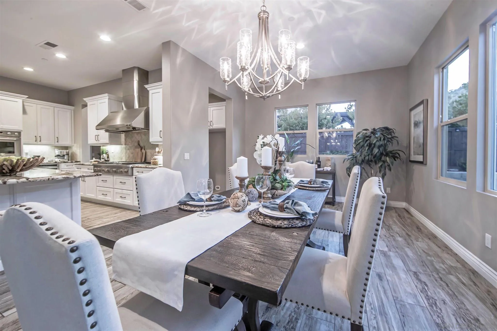 545 Ledge Street San Marcos, CA 92078 - Photo 21 of 55 a living room with fireplace furniture and a chandelier