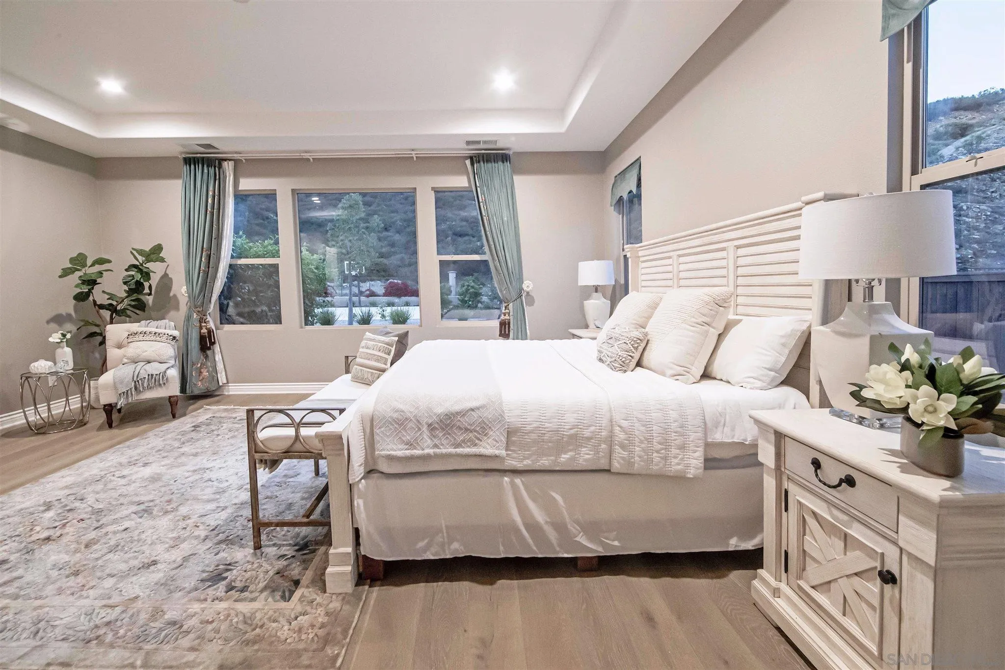 545 Ledge Street San Marcos, CA 92078 - Photo 27 of 55 a bedroom with a bed table flowerpot and window