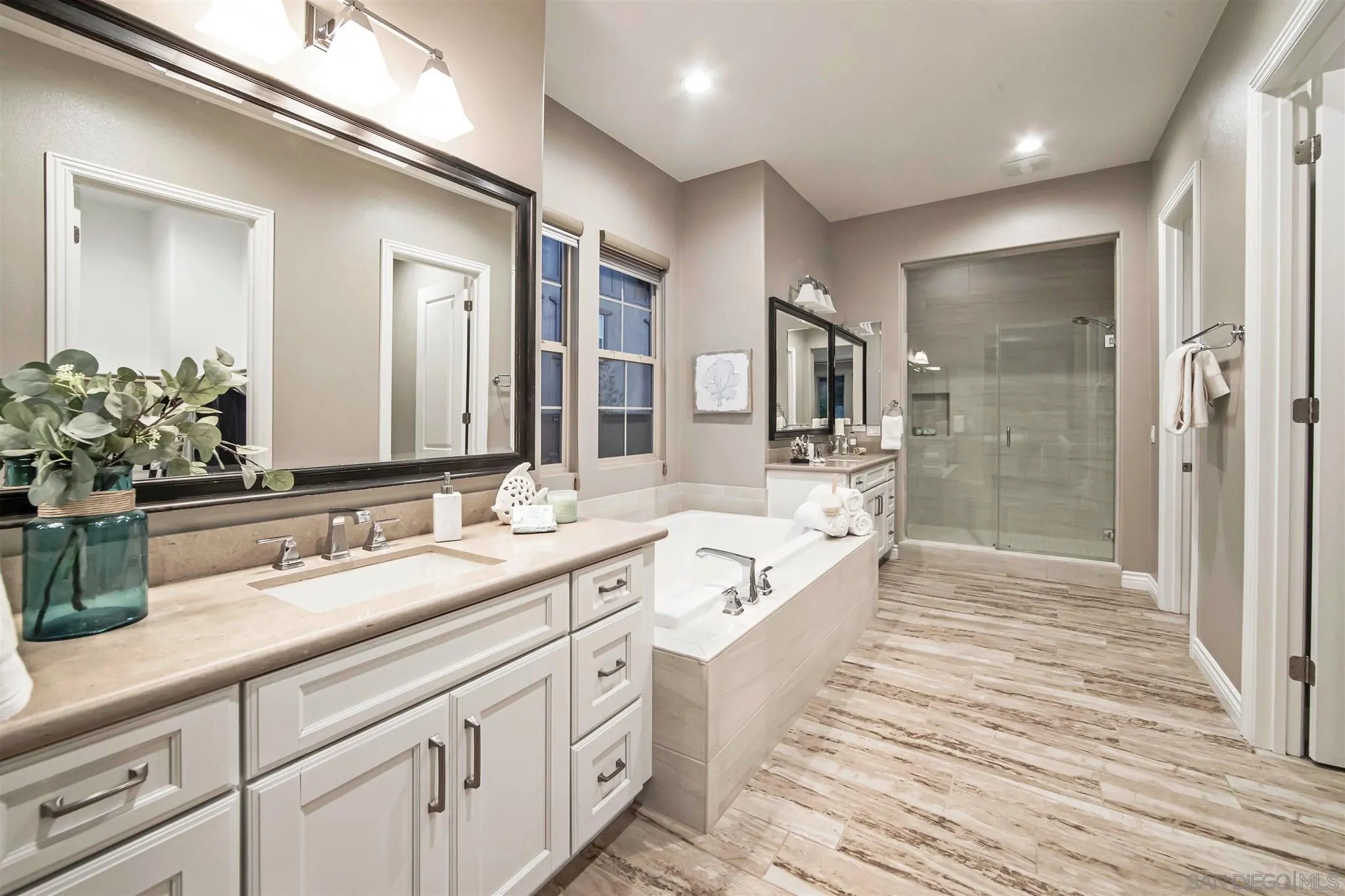 545 Ledge Street San Marcos, CA 92078 - Photo 30 of 55 a spacious bathroom with double vanity a mirror and a shower