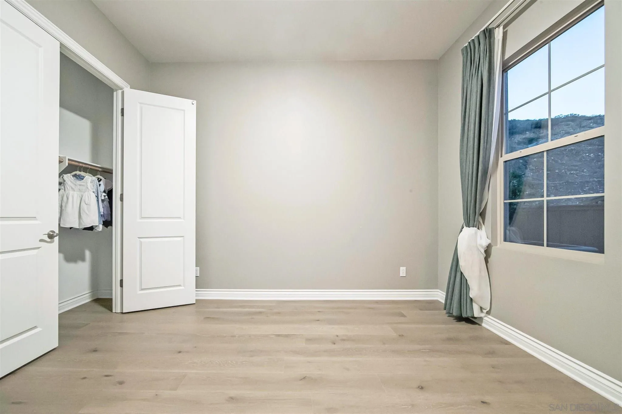 545 Ledge Street San Marcos, CA 92078 - Photo 34 of 55 an empty room with windows and closet