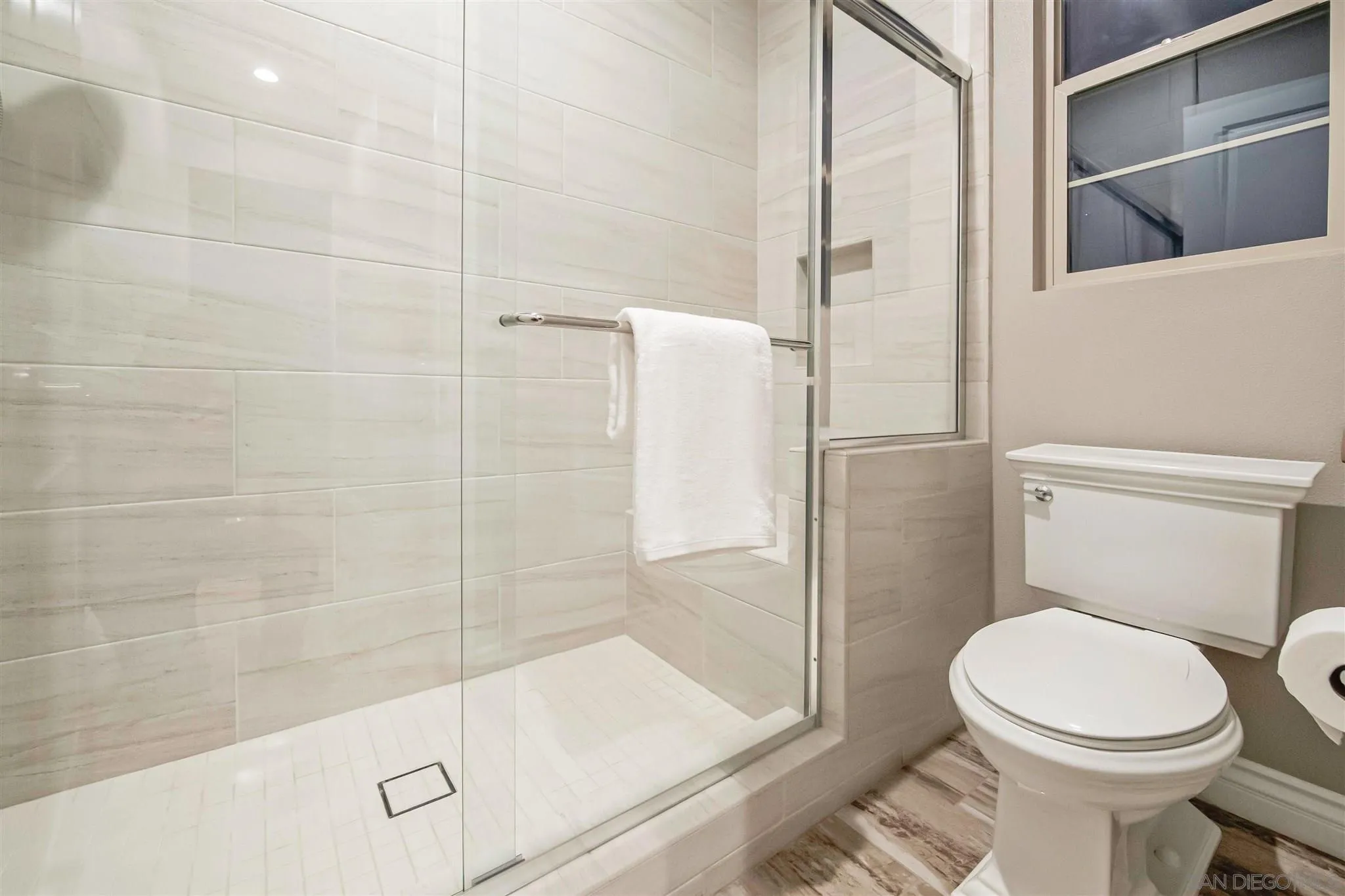 545 Ledge Street San Marcos, CA 92078 - Photo 37 of 55 a bathroom with a toilet and a shower