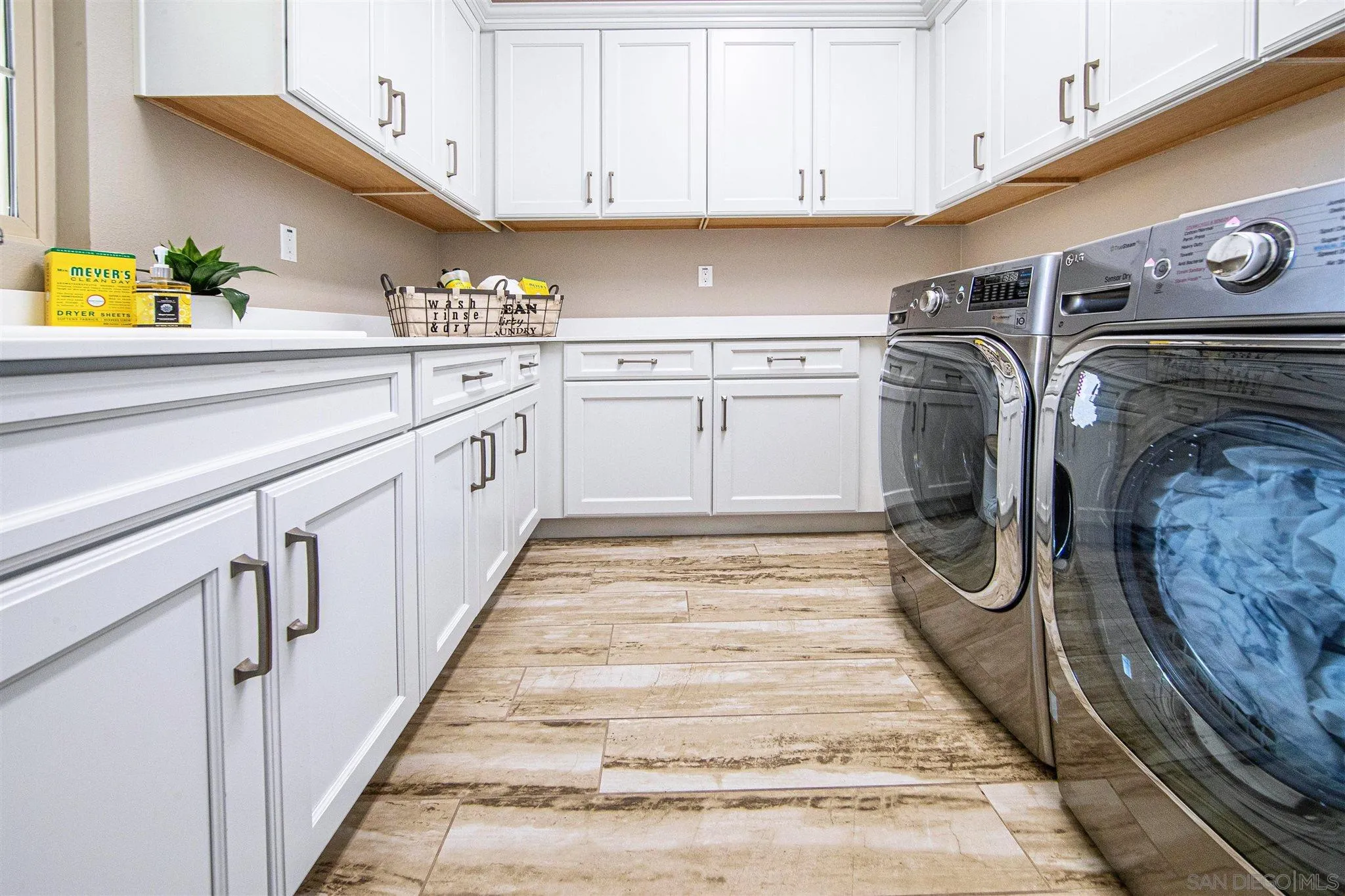 545 Ledge Street San Marcos, CA 92078 - Photo 40 of 55 a kitchen with stainless steel appliances granite countertop a sink and cabinets