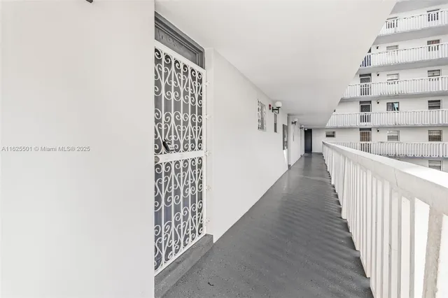 a view of a hallway with windows