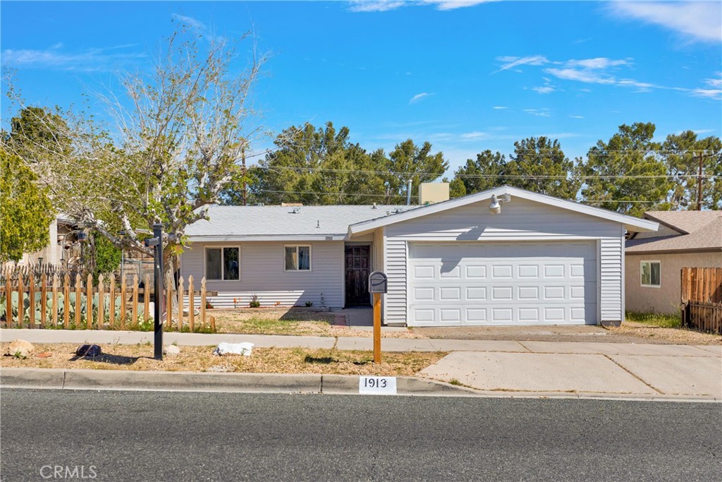 1913 Armory Road Barstow, CA 92311 - Photo 1 of 1 a front view of a house with a outdoor space