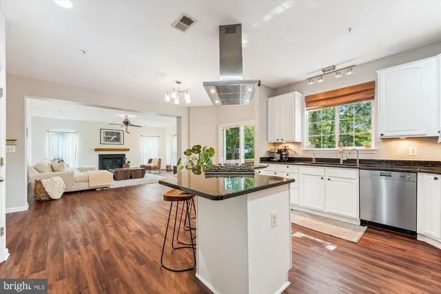 a dining room with furniture and wooden floor