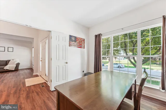 a spacious bedroom with a bed and fireplace