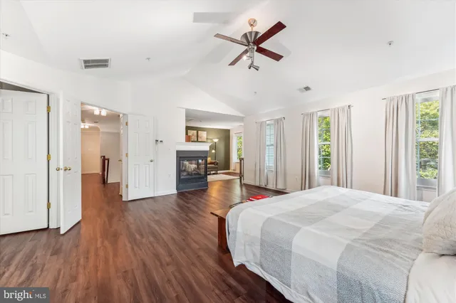 a view of room with window and wooden floor