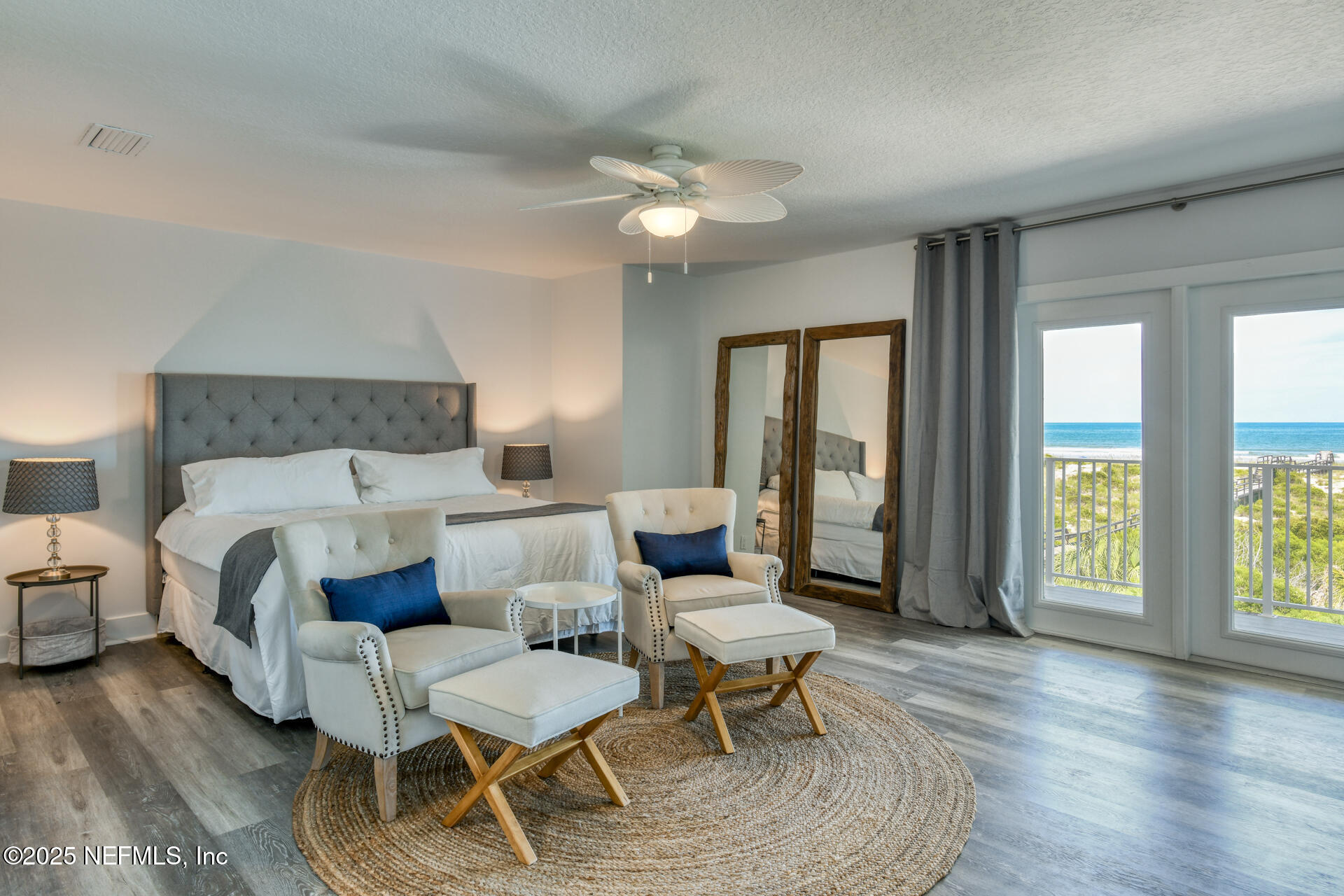 5072 Atlantic View St. Augustine, FL 32080 - Photo 22 of 68 a bedroom with a bed and wooden floor