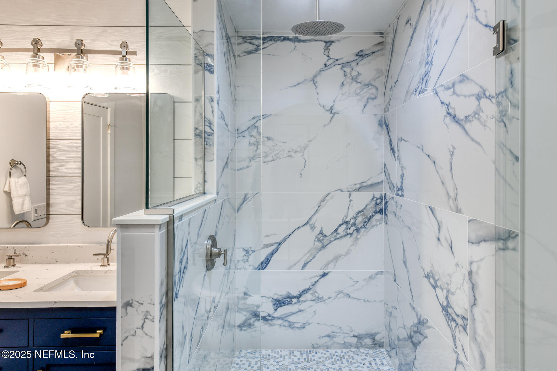 5072 Atlantic View St. Augustine, FL 32080 - Photo 28 of 68 a bathroom with a shower and a mirror