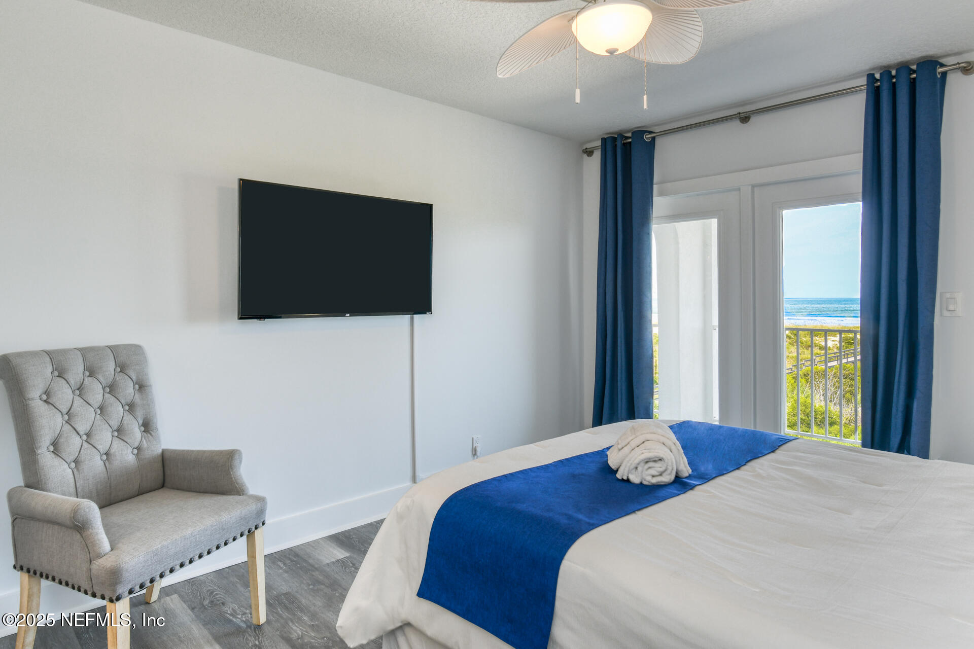 5072 Atlantic View St. Augustine, FL 32080 - Photo 30 of 68 a bedroom with a bed and a flat screen tv