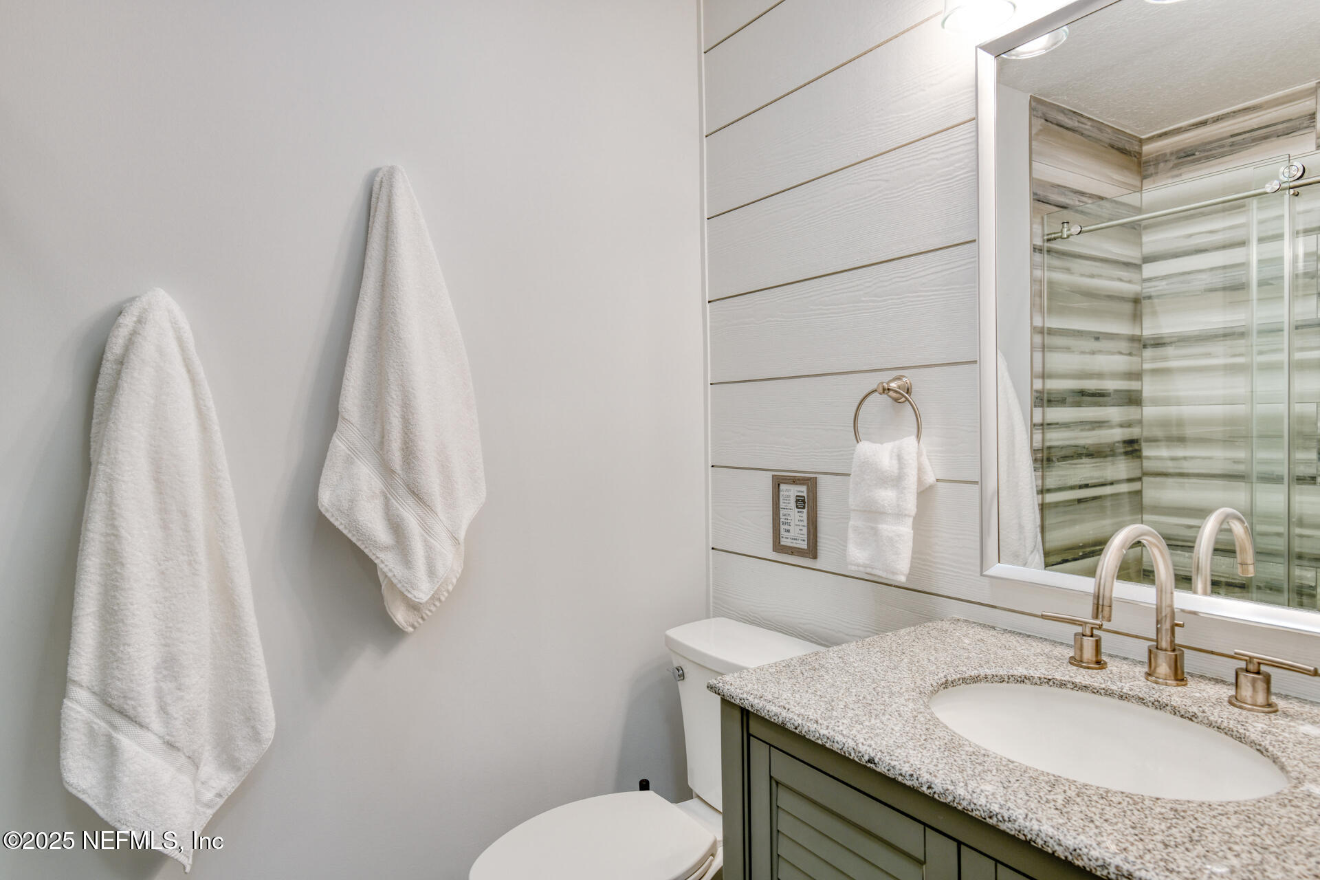 5072 Atlantic View St. Augustine, FL 32080 - Photo 33 of 68 a bathroom with a granite countertop sink toilet and shower