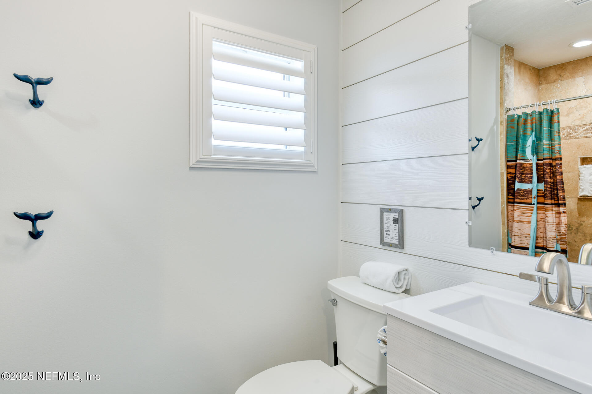 5072 Atlantic View St. Augustine, FL 32080 - Photo 40 of 68 a bathroom with a sink and a toilet