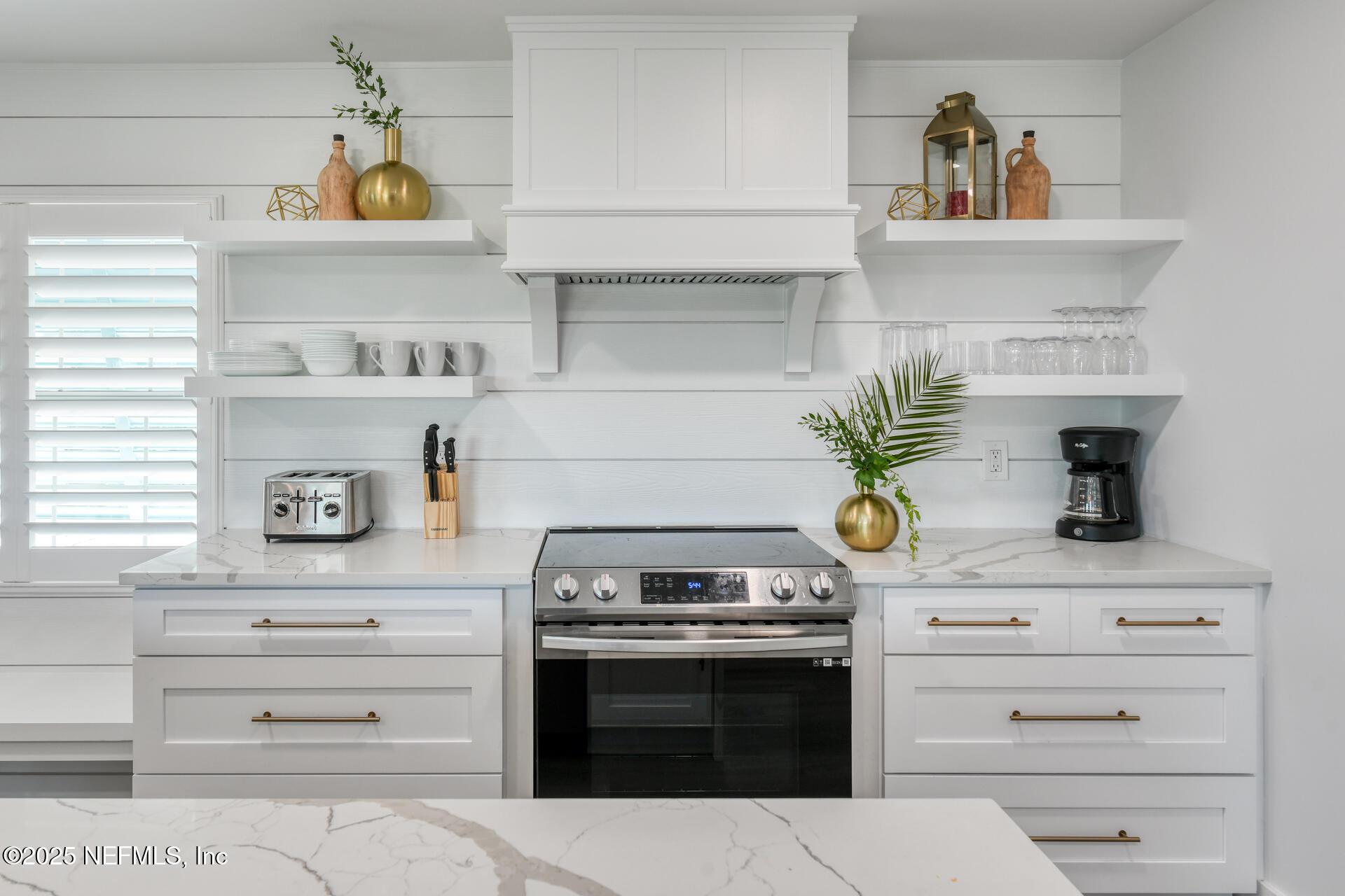 5072 Atlantic View St. Augustine, FL 32080 - Photo 7 of 68 a kitchen with a stove and cabinets