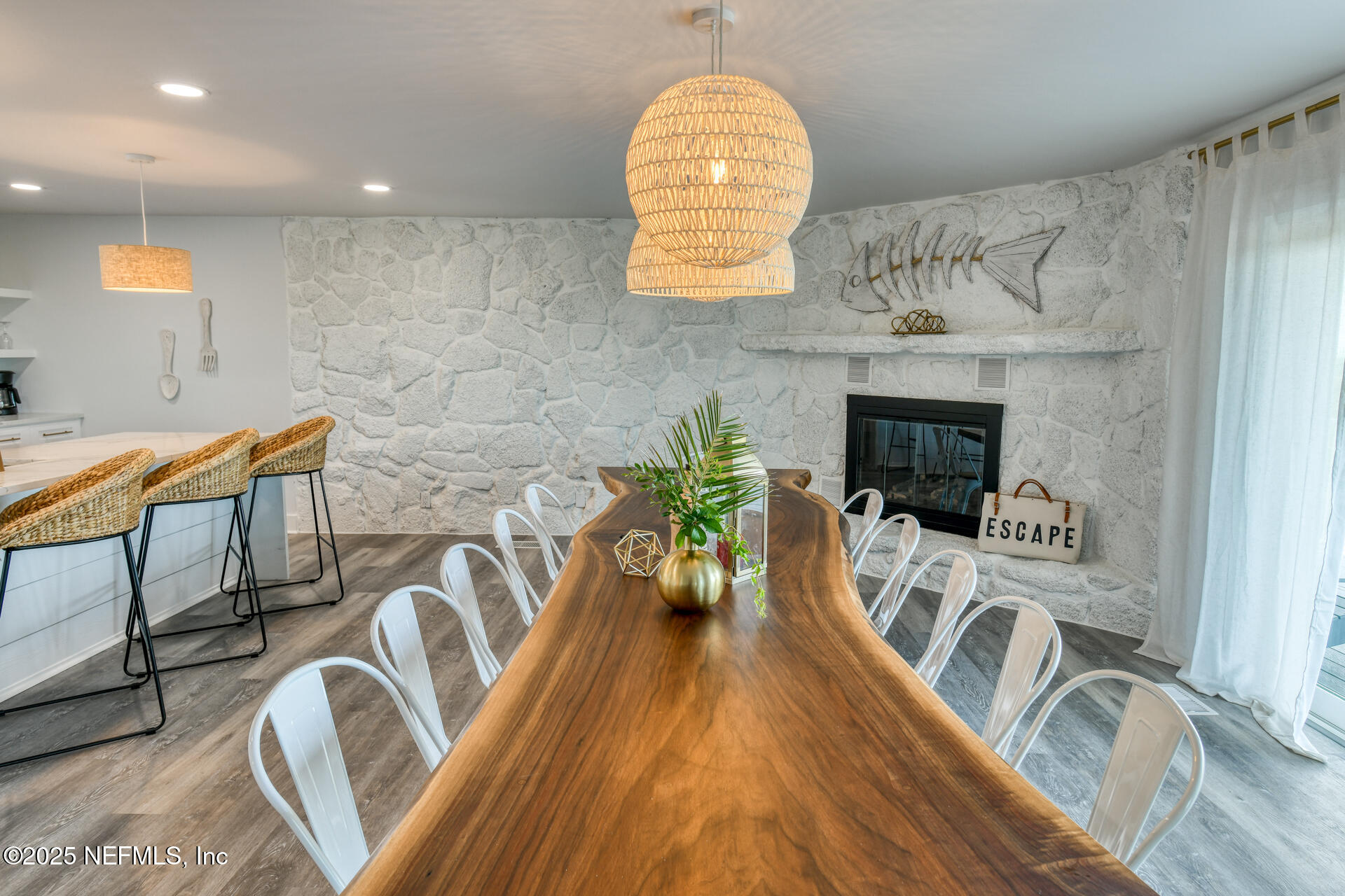 5072 Atlantic View St. Augustine, FL 32080 - Photo 10 of 68 a living room with furniture a fireplace and a floor to ceiling window