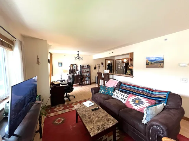 a living room with furniture and a table