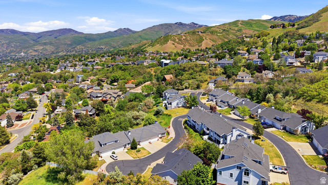 3766 Cardiff Circle Bountiful, UT 84010 - Photo 44 of 46 Residential community featuring a variety of architectural styles, mature trees, paved streets, and a mountainous backdrop under a clear sky
