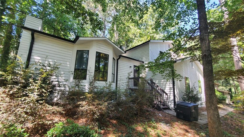 209 Mill Ridge Court Lawrenceville, GA 30046 - Photo 4 of 11 a view of a house with a yard