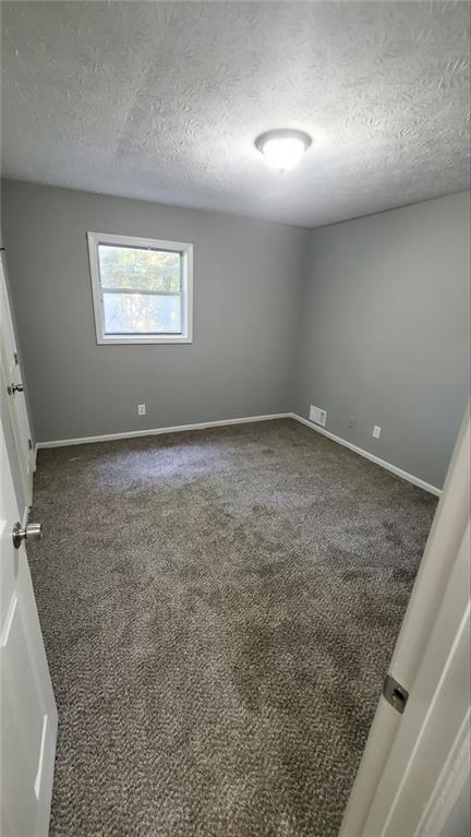 209 Mill Ridge Court Lawrenceville, GA 30046 - Photo 7 of 11 an empty room with a empty space and windows