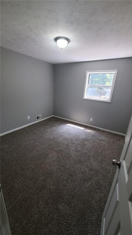 209 Mill Ridge Court Lawrenceville, GA 30046 - Photo 9 of 11 an empty room with windows