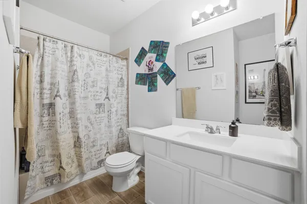 a bedroom with a bed and a vanity
