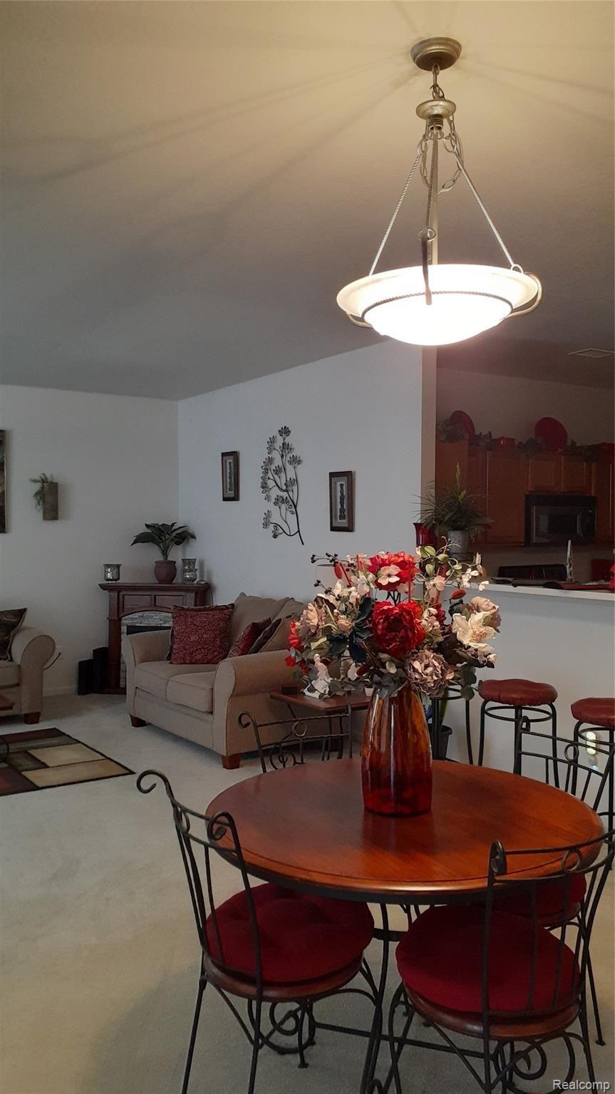 23438 Ridgeview Street, Unit 5 Taylor, MI 48180 - Photo 9 of 13 Dining Area and Peek of Living Room & Kitchen from Foyer