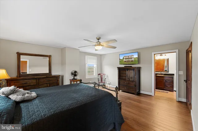 a bedroom with furniture and a fireplace
