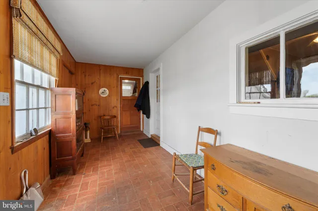 a view of a livingroom with furniture and windows