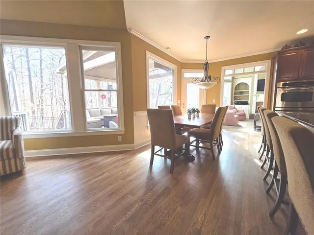 a spacious bedroom with a bed and a flat screen tv