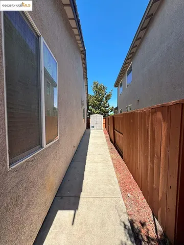 a view of a kitchen with kitchen island and a sink