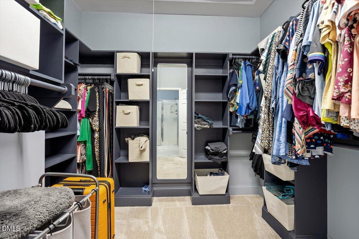 115 Hidden Fox Path Garner, NC 27529 - Photo 12 of 20 Walk-in closet with wood shelving