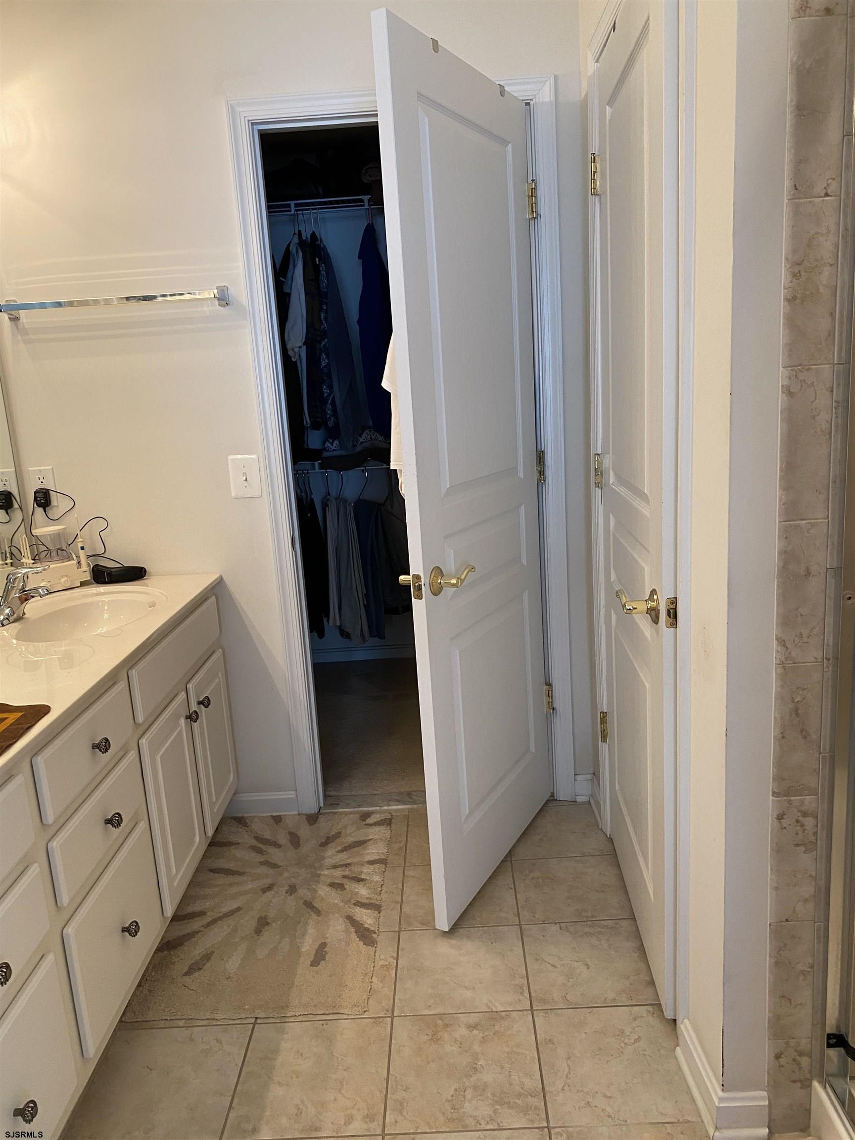 2 Old Mill Drive, Unit 2 Voorhees, NJ 08043 - Photo 11 of 20 a bathroom with a sink and a mirror