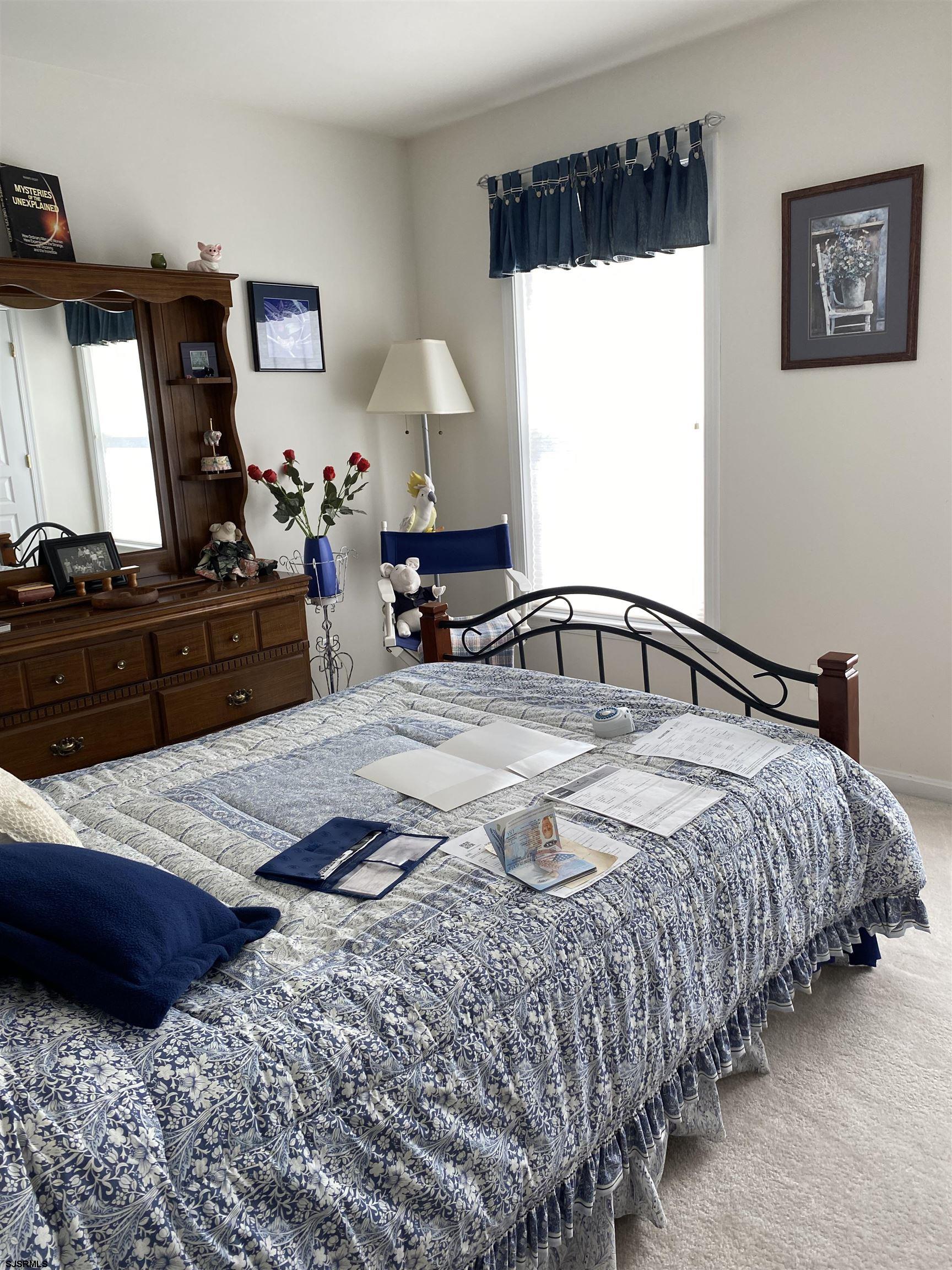 2 Old Mill Drive, Unit 2 Voorhees, NJ 08043 - Photo 14 of 20 a bed room with a bed window and a mirror