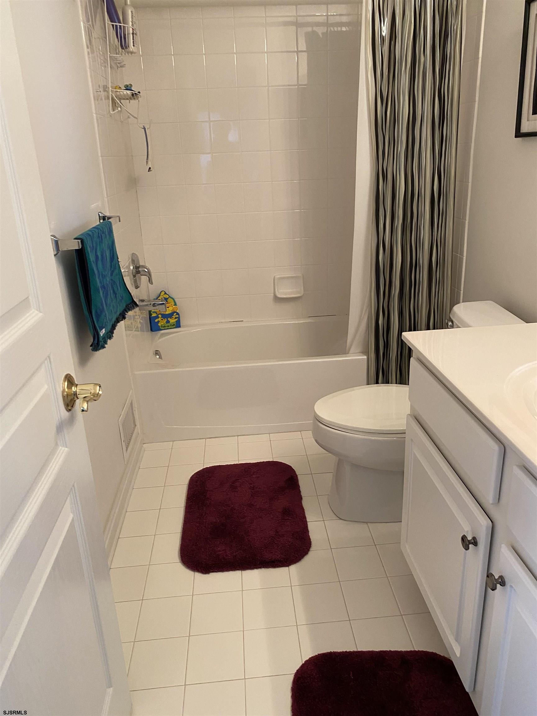2 Old Mill Drive, Unit 2 Voorhees, NJ 08043 - Photo 16 of 20 a bathroom with a sink a toilet and a bathtub