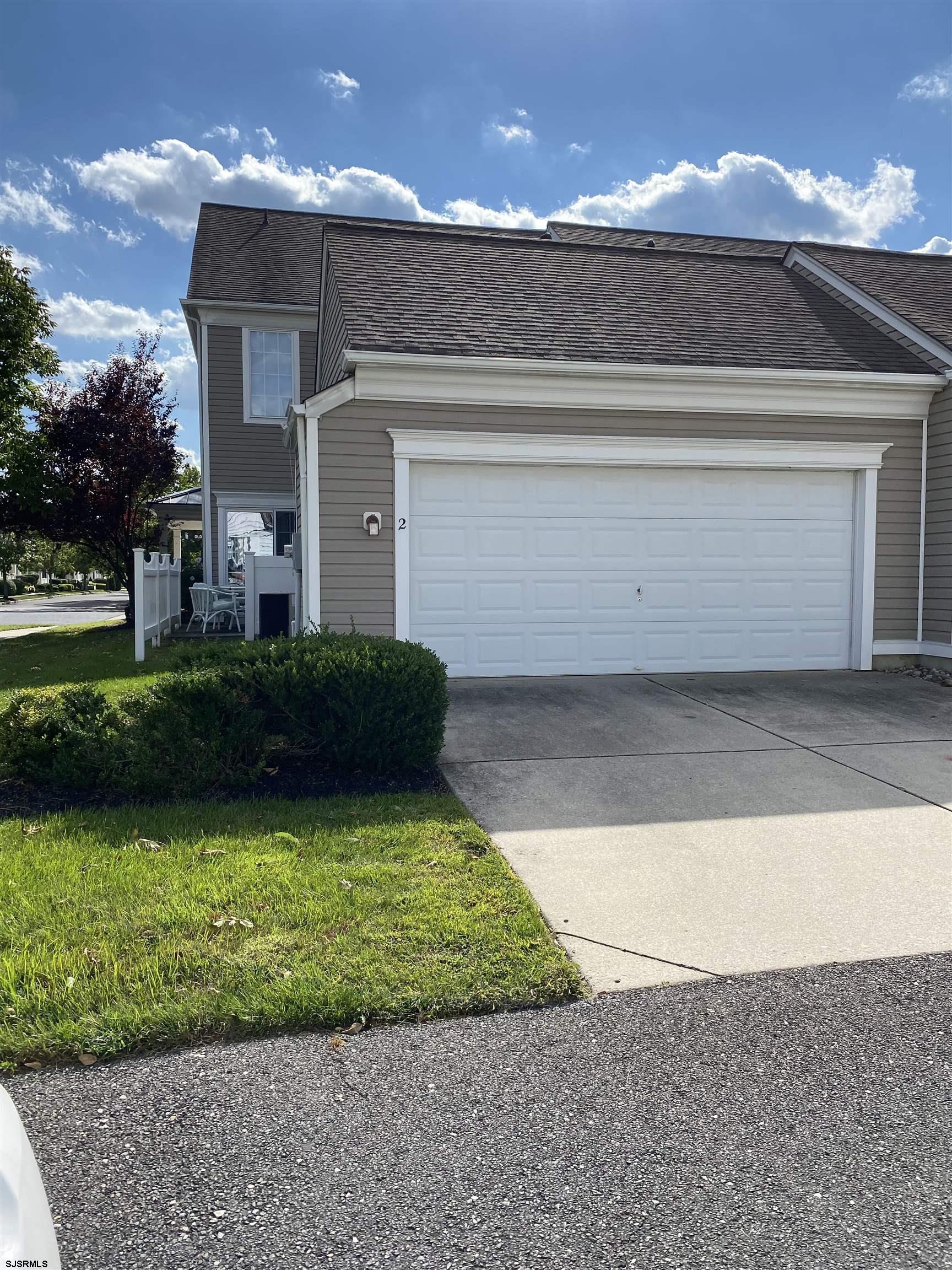 2 Old Mill Drive, Unit 2 Voorhees, NJ 08043 - Photo 2 of 20 a view of a house with a yard and garage
