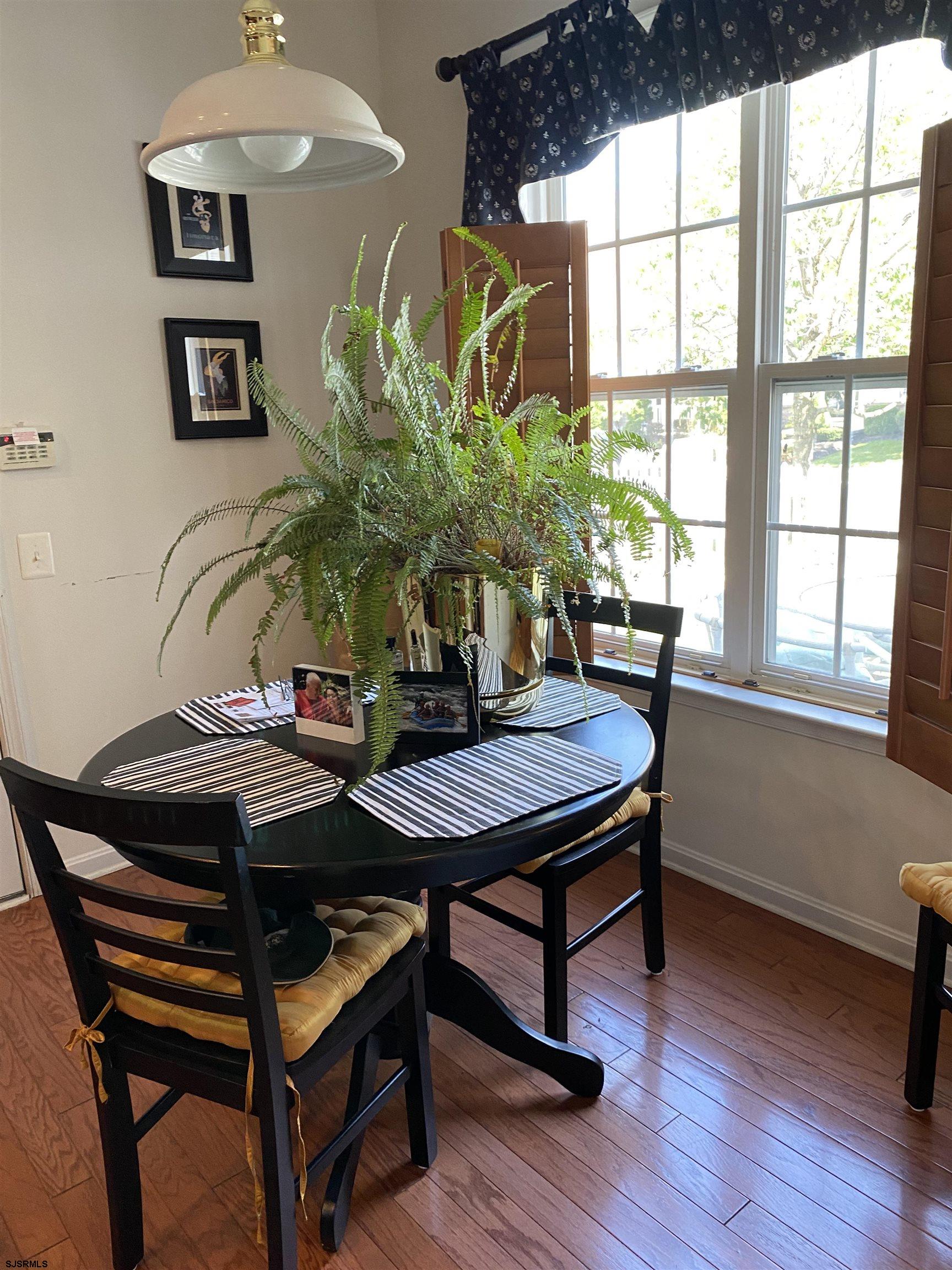 2 Old Mill Drive, Unit 2 Voorhees, NJ 08043 - Photo 9 of 20 a view of a dining room with furniture window and wooden floor