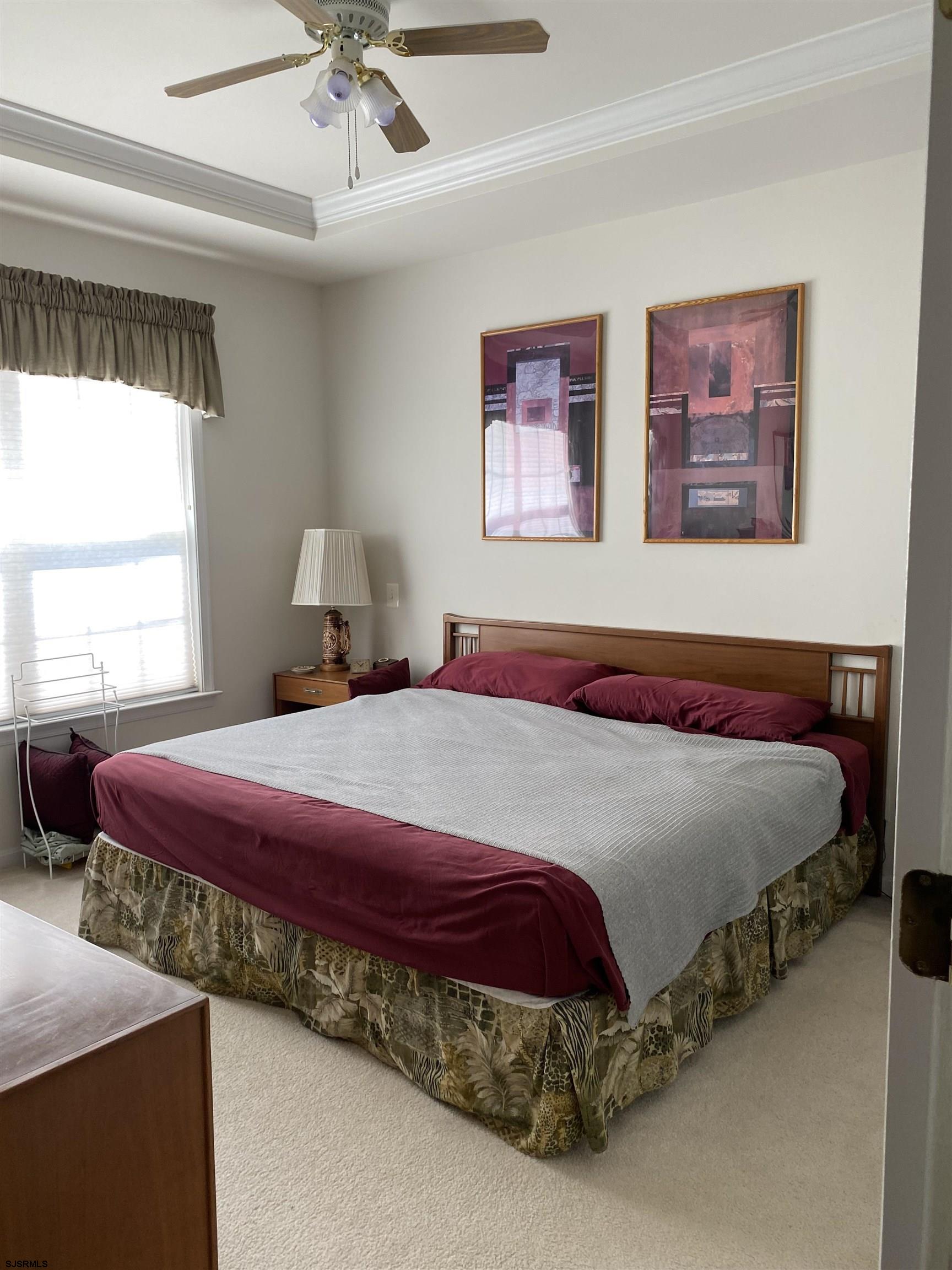 2 Old Mill Drive, Unit 2 Voorhees, NJ 08043 - Photo 10 of 20 a bedroom with a bed and a chandelier