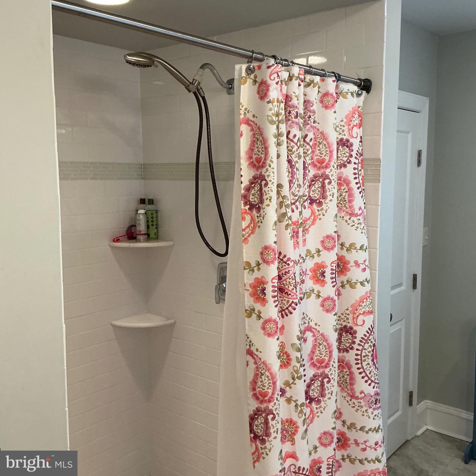 29 Centre Street Haddonfield, NJ 08033 - Photo 25 of 39 a bathroom with a shower curtain and a sink